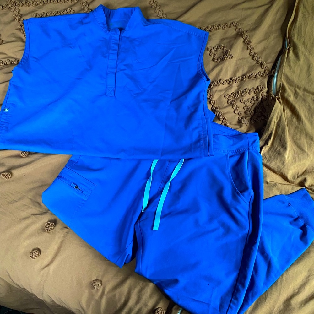 Figs royal blue scrubs.